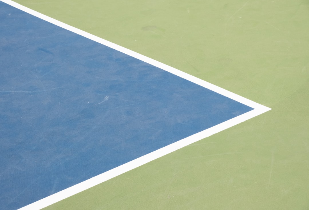 Close-up of custom acrylic pickleball court surface colors and finish