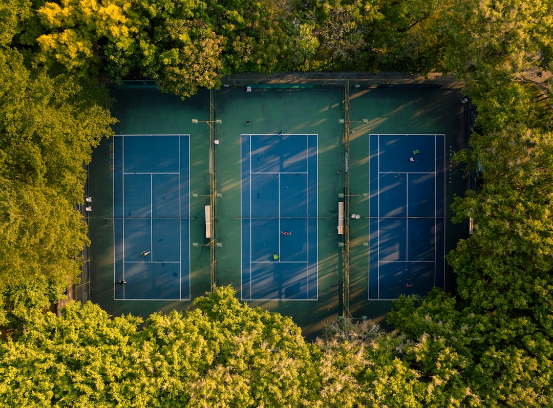 Professional game court contractor crew working on an Arizona backyard court