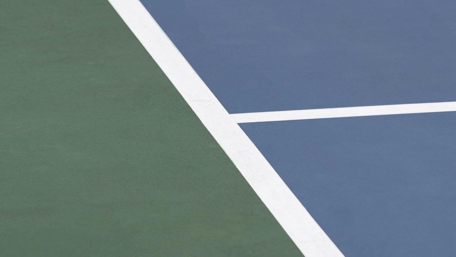 Colorful interlocking modular tile surface used for outdoor pickleball courts