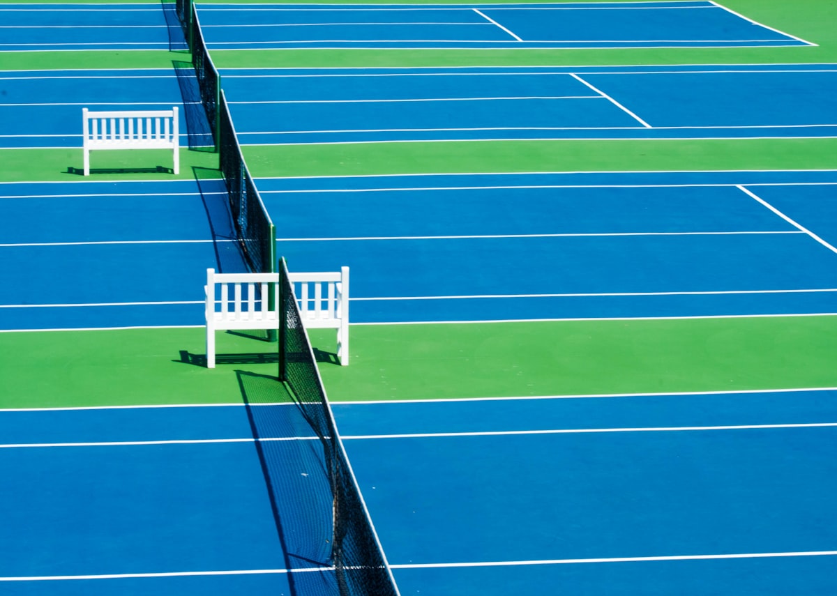 Multiple outdoor sport courts finished with color surface coating systems