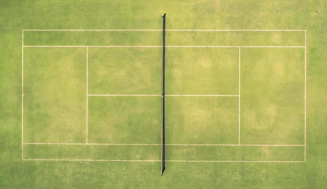 Outdoor court showing regulation boundary lines and total playing dimensions